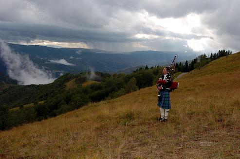 Colorado bagpiper in Vail piping reverent tunes at dusk, Photo by Debbie Malone